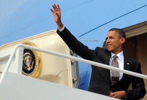 President Barack Obama boards Air Force One